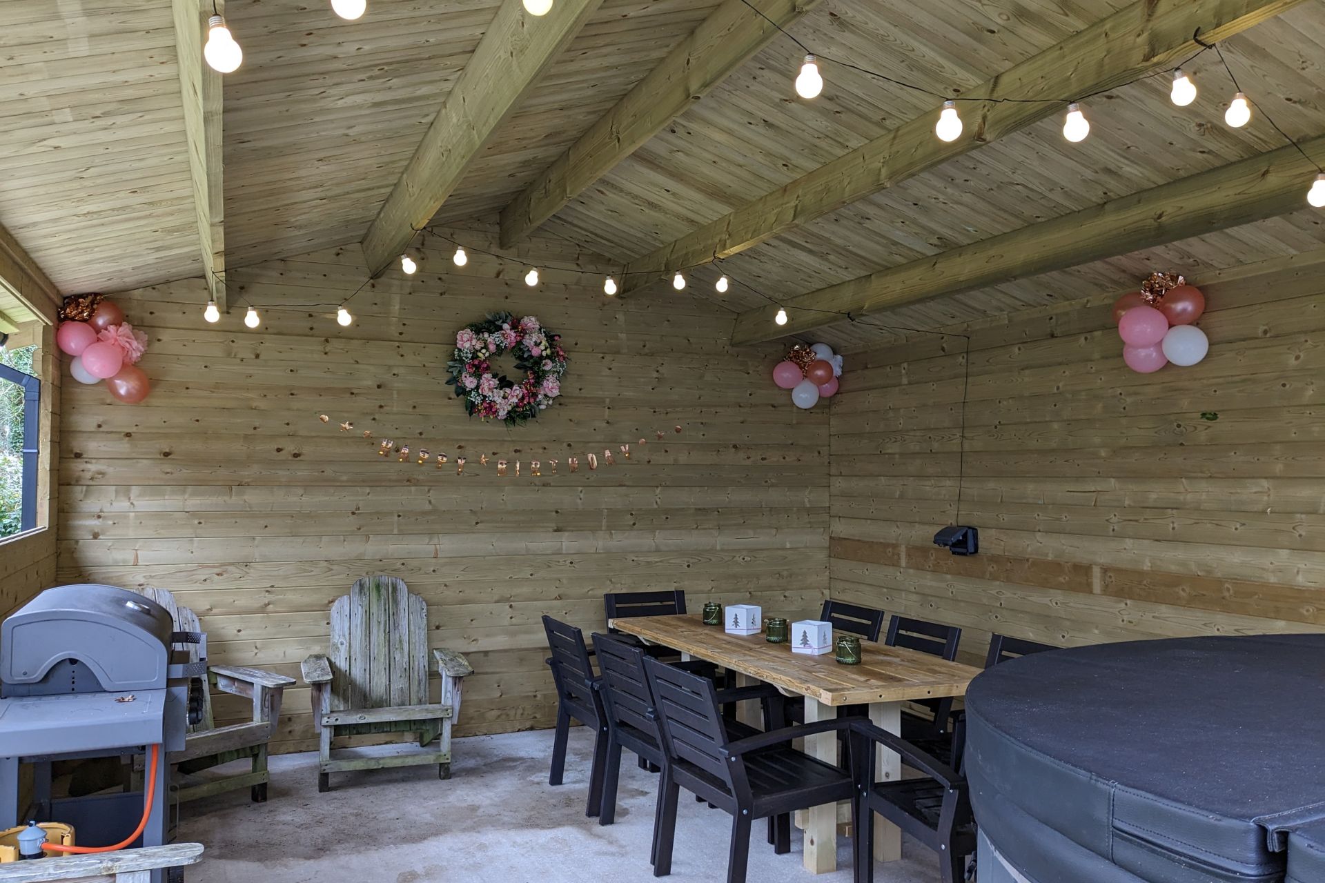 Outdoor kitchen shed with furniture